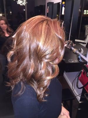 All over copper with an organic pop of sun kissed highlights. Long layered cut to compliment her beautiful color.