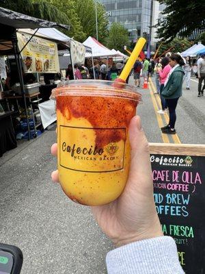 Mango smoothie with a tajin straw.