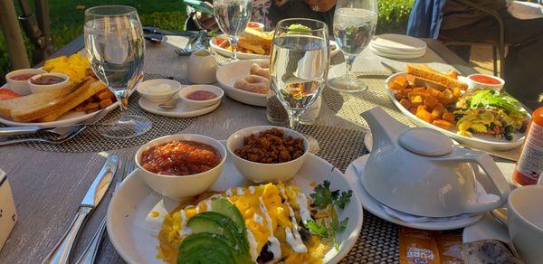 Huevos Rancheros with sauce and chorizo on the side