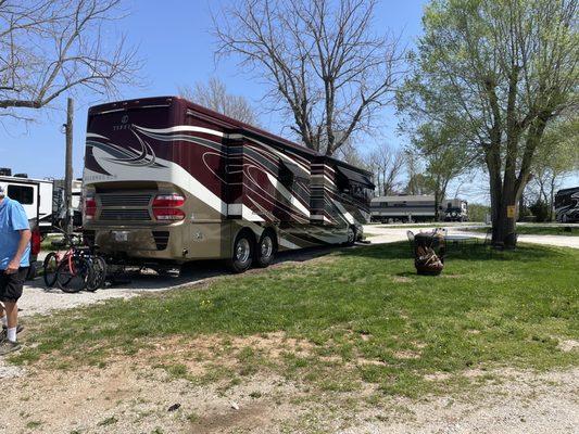 Spacious big rig site with table, chairs and fire ring.