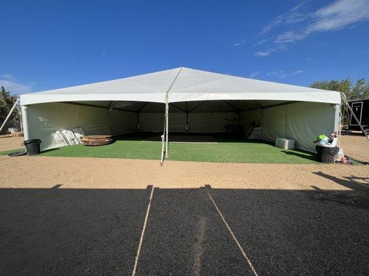 40x40 tent with artificial grass, tables, chairs, linen, lights and a dance floor