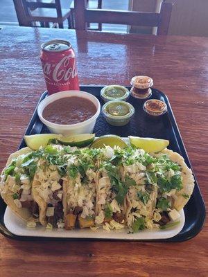 2 Carne asada, 2 chicken and 2 lengua tacos, side of bean's. Delicious