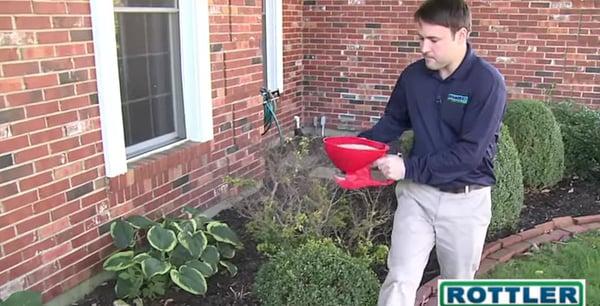 A Rottler technician performing an exterior pest treatment.