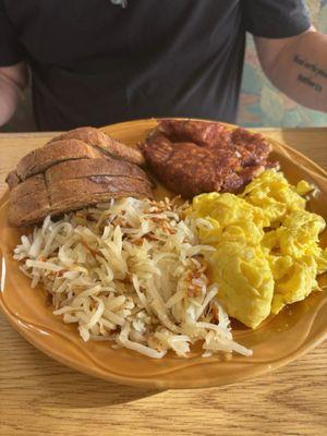 Corned beef hash, scrambled, hash browns and rye toast.