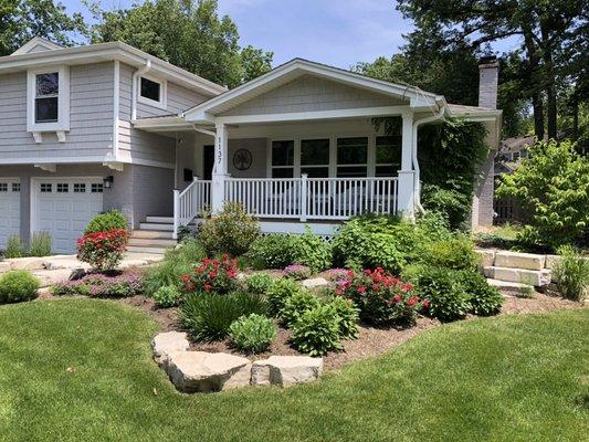 Large chunks of limestone help to punch up the curb appeal of this Northbrook home...