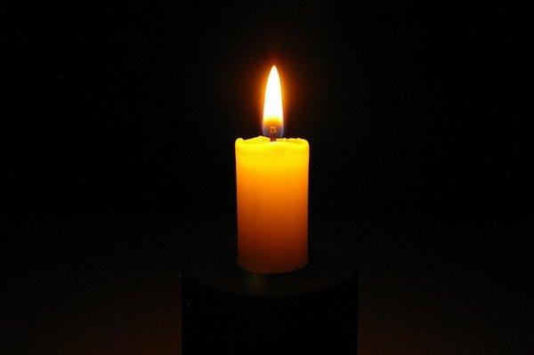 Candle in the dark implicating hope