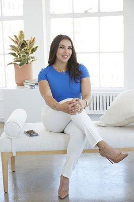 We liked how this feels like a broker in an open house at a loft! :) A young real estate professional photographed in the studio May 2023.