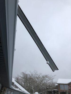 One of the snow rails that was incorrectly installed-you can see it was only screwed to the roof on the bottom instead of both bottom & top.