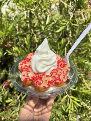 Soft serve ice cream with a fresh, hot mochi donut