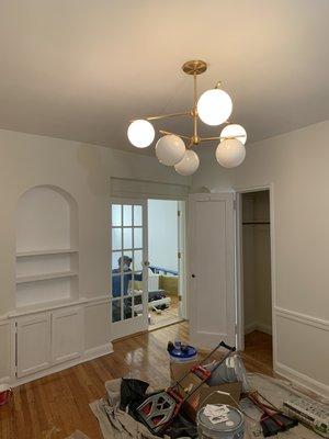 Paint walls and install light fixtures