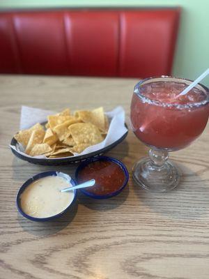 Raspberry Margarita, queso dip and salsa.