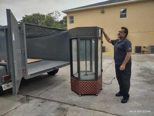 James is about to load an unwanted bulky item into his dump trailer.