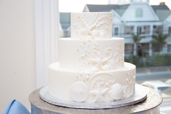 Wedding cake with almond cake and raspberry mousse filling