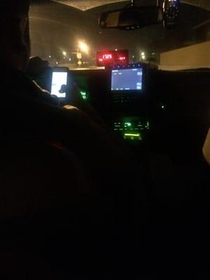 I took a cab to avoid driving after some drinks. This is my cab driver texting and driving.