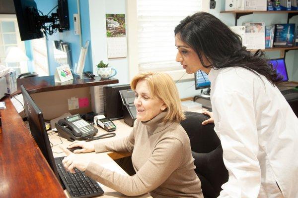 Dr. Shevchenko and Sue (Hygienist) working at the front