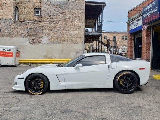 C6 corvette paint corrected and calipers painted yellow with yellow tire stickers to match.