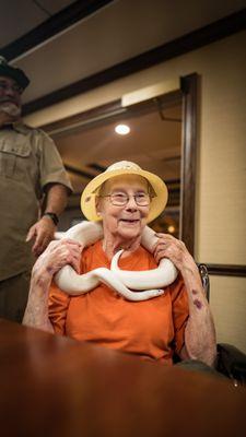 Resident enjoying our "All God's Creatures" Event, where HomeHelpers came with a variety of animals for our residents to pet and hold!