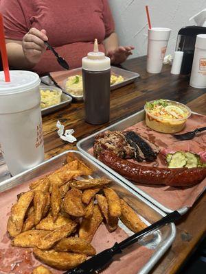 3 meat plate with pulled pork, sliced brisket, and hot link with 2 sides.