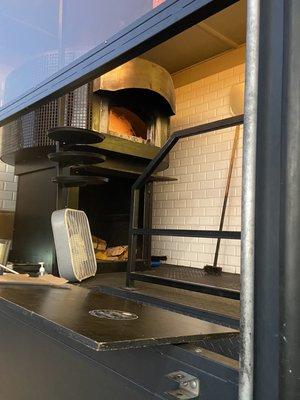 Wood burning oven! They use almond which adds a nice flavor to the dough.