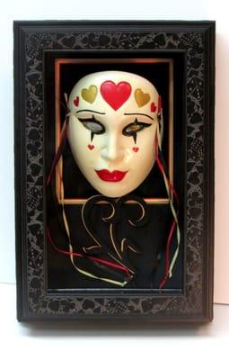 We make one of a kind, custom showcases; like this Queen of Hearts poker themed case on this masque.