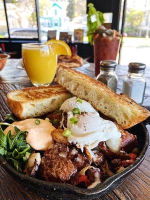 Pork Belly Hash with Poached egg, Griddle Toast, and Spicy Calabrian Sour Creme!