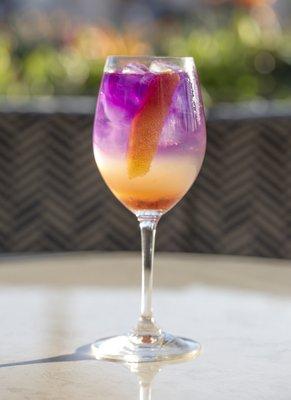 GIN SPRITZER; ramazzotti rosato, lemon, prosecco, butterfly pea-infused gin