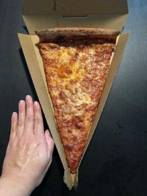 Single slice of cheese compared to the size of my hand