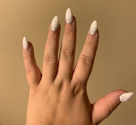 No chip almond shaped acrylics. Chalk white with silver glitter ombré by Hannah. Love it every time!