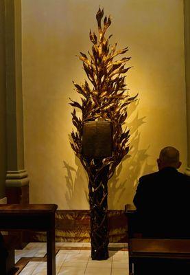 Created by the same sculptor as the bronze doors, Ulrich Henn. This is the tabernacle that holds the Holy Communion.