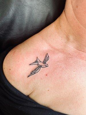 Beautiful swallow tattoo on my shoulder. The artist was amazing, very precise and professional. Love the detail and simplicity!