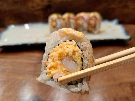 White Dragon roll - spicy crab and deep fried shrimp topped with escolar and albacore