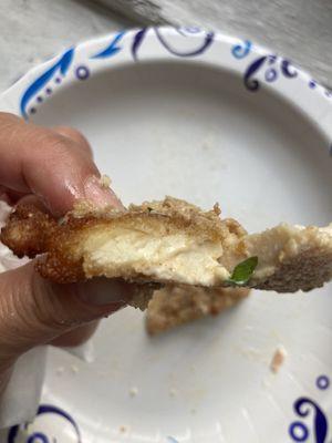 Cooked piece of chicken in sandwich