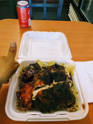 The gigantic portions here! Jerk chicken, cabbage and rice