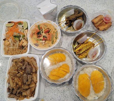 Drunken noodles with beef, shrimp pad Thai, red curry with chicken, beef & chicken satay, crispy spring roll and mango with sticky rice