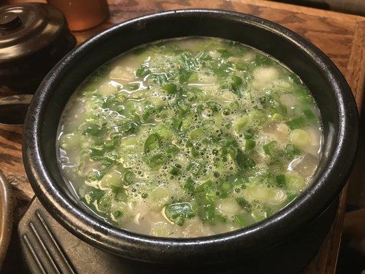 dogani tang or beef bone broth / tendon stew with scallions. The broth is stewed for 3 days which gives it a rich flavor and silky texture.