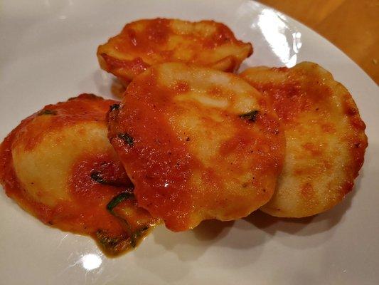 Plain cheese ravioli with vodka sauce and fresh basil.