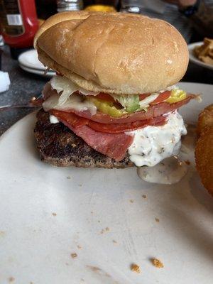 Same Toman burger - the huge patty is hanging over the bun!