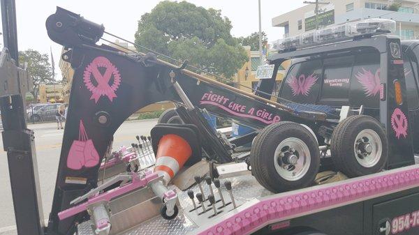 Can't help but love their "Fight Like a Girl" Breast Cancer Support wrecker truck