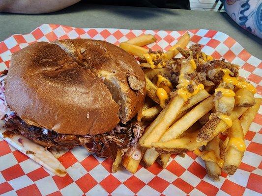 Pulled pork sandwich with bacon cheese fries.