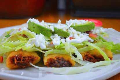 TAMALES CHILANGO 3 fried tamales topped with cheese dip lettuce, sour cream, pico de Gallo mexican cheese and avocado slices