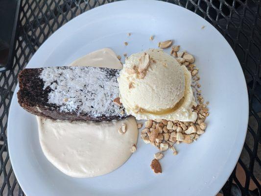 Chocolate cake on bed of cashew cream with vanilla gelato. Mother's day special. Delicious.