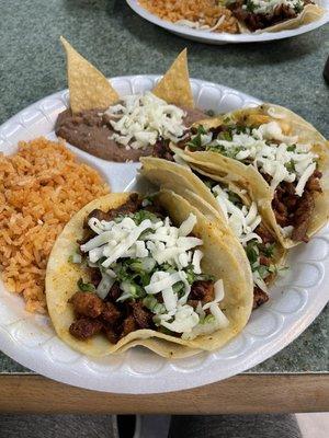 Carne asada tacos with rice and beans