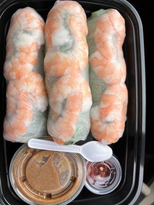 Shrimp spring rolls...DELICIOUS peanut sauce (well balanced). Add the pepper sauce & it's perfect. Love the tiny spoons!!!