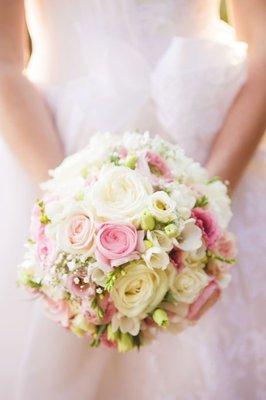 Pale pinks, greens and white flowers. Bridal bouquet