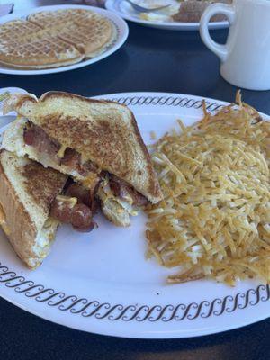 Bacon, egg and cheese on Texas toast with hash browns