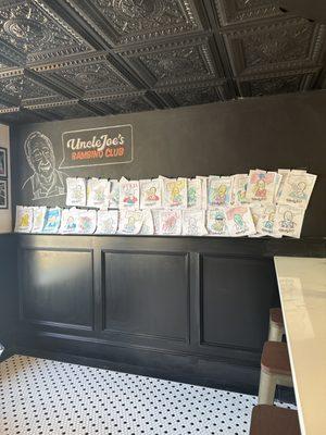 Kids can color Uncle Joe! The staff hang it up infront of the restaurant after "buying" the drawing with our bambino bucks!