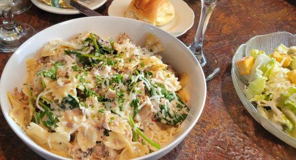 Smoked Pork and pasta in a cream sauce with Caesar salad and a roll