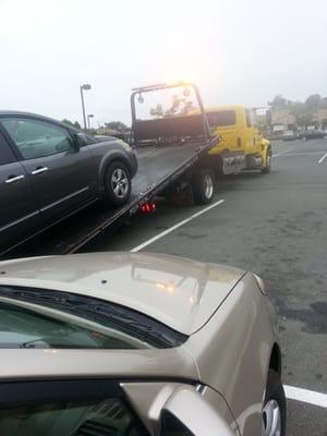 My car getting pulled up on the flatbed