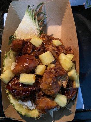 Teriyaki chicken and rice in a pineapple bowl