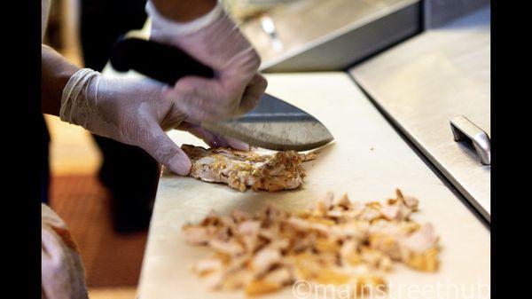 Freshly Grilled chicken breast ready to go on top of a pizza